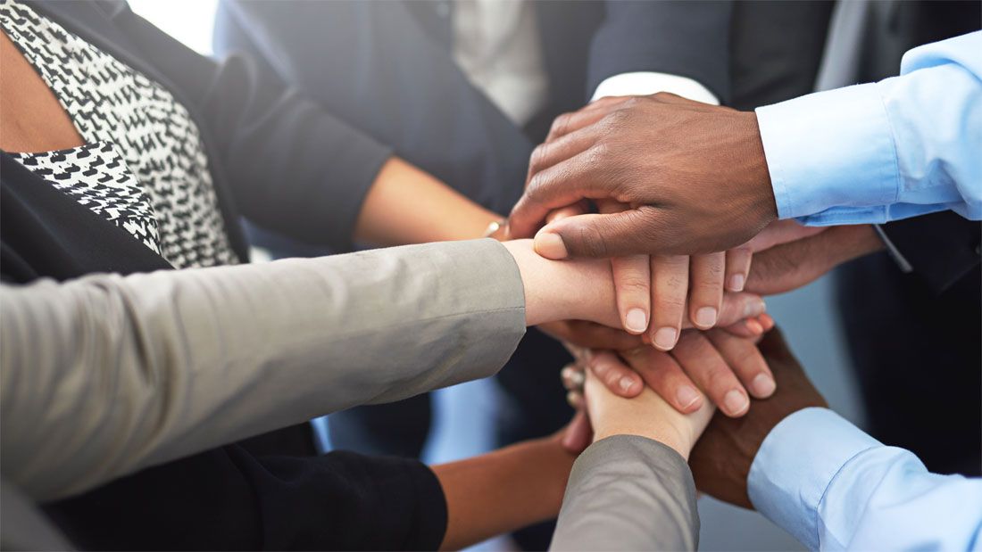 hands in a huddle